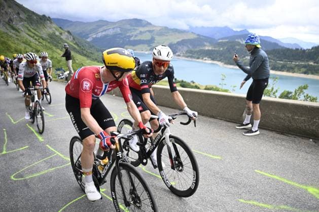 Norwegian Andreas Leknessund of Uno-X Mobility and Belgian Tim Wellens of UAE Team Emirates pictured in action during stage 19 of the 2025 Tour de France cycling race, from Albertville to La Plagne (130km), on Friday 25 July 2025 in France. The 112th edition of the Tour de France starts on Saturday 5 July in Lille, France, and will finish in Paris, France on the 27th of July. JASPERxJACOBS  x129996280x