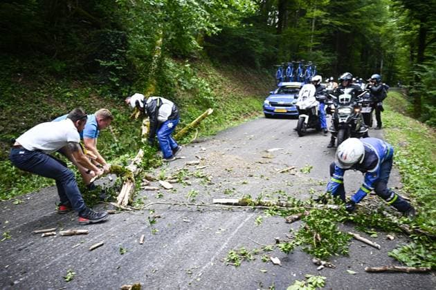 People removing tree branches on the parcours during stage 20 of the 2025 Tour de France cycling race, from Nantua to Montpellier (185km), on Saturday 26 July 2025 in France. The 112th edition of the Tour de France starts on Saturday 5 July in Lille, France, and will finish in Paris, France on the 27th of July. JASPERxJACOBS  x130043797x