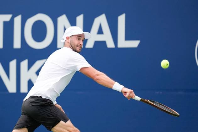 ATP, Tennis Herren Masters 1000 National Bank Open Toronto Presented by Rogers 2025 - Day 1 Dan Martin of Canada plays a backhand against Taro Daniel of Japan during the Men s Singles first round match on day 1 of the ATP Masters 1000 National Bank Open at Sobeys Stadium. on July 26, 2025 in Toronto, Canada. Toronto Ontario Canada Copyright: xLeonardoxRamirezx