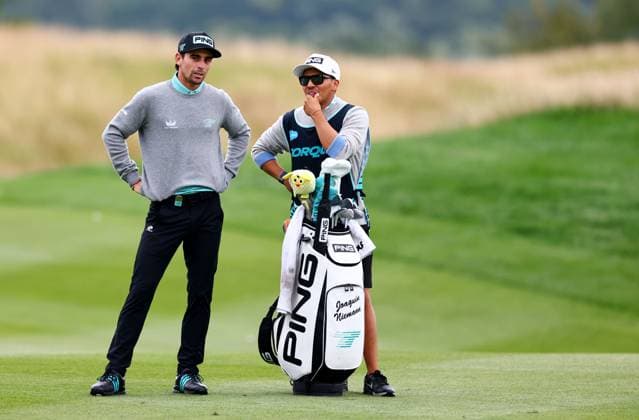 Joaquin Niemann of Chile and caddie Diego Salinas. LIV Golf UK, Day Three, Golf, JCB Golf & Country Club, Uttoxeter, UK - 27 Jul 2025Uttoxeter JCB Golf & Country Club United Kingdom EDITORIAL USE ONLY No use with unauthorised audio, video, data, fixture lists, club league logos or live services. Online in-match use limited to 120 images, no video emulation. No use in betting, games or single club league player publications. Copyright: xJamesxMarsh Shutterstockx 15410873l