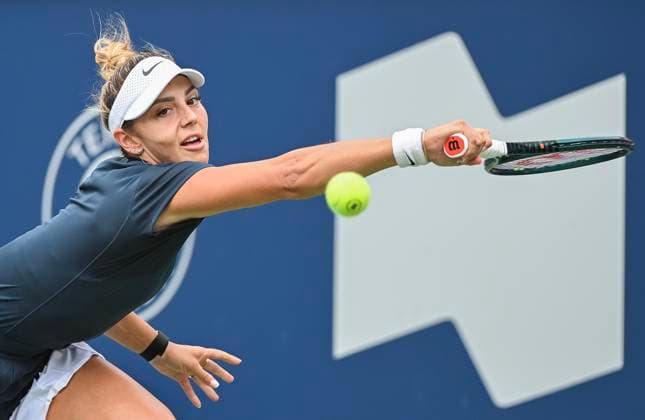 July 27, 2025, Montreal, Pq, Canada: Jaqueline Cristian, of Romania, lunges for the ball during her first round match against Marina Stakusic, of Canada, at the National Bank Open tennis tournament in Montreal, Sunday, July 27, 2025. Marina Stakusic, Jaqueline Cristian,  - ZUMAc35_ 20250727_zaf_c35_006 Copyright: xGrahamxHughesx