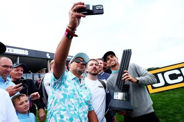 Joaquin Niemann of Chile celebrates winning the tournament with fans. LIV Golf UK, Day Three, Golf, JCB Golf & Country Club, Uttoxeter, UK - 27 Jul 2025Uttoxeter JCB Golf & Country Club United Kingdom EDITORIAL USE ONLY No use with unauthorised audio, video, data, fixture lists, club league logos or live services. Online in-match use limited to 120 images, no video emulation. No use in betting, games or single club league player publications. Copyright: xJamesxMarsh Shutterstockx 15410873bs