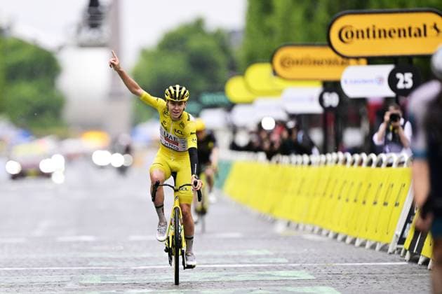 Slovenian Tadej Pogacar of UAE Team Emirates celebrates as he crosses the finish line of stage 21 of the 2025 Tour de France cycling race, from Mantes-la-Ville to Paris (120km), on Sunday 27 July 2025 in France. The 112th edition of the Tour de France starts on Saturday 5 July in Lille, France, and will finish in Paris, France on the 27th of July. DIRKxWAEM  x130134450x