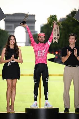 Irish Ben Healy of EF Education-EasyPost celebrates on the podium with the combativity award after stage 21 of the 2025 Tour de France cycling race, from Mantes-la-Ville to Paris (120km), on Sunday 27 July 2025 in France. The 112th edition of the Tour de France starts on Saturday 5 July in Lille, France, and will finish in Paris, France on the 27th of July. POOLxBERNARDxPAPON  x130134657x