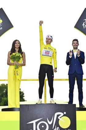 Slovenian Tadej Pogacar of UAE Team Emirates celebrates on the podium in the yellow jersey of leader in the overall ranking after stage 21 of the 2025 Tour de France cycling race, from Mantes-la-Ville to Paris (120km), on Sunday 27 July 2025 in France. The 112th edition of the Tour de France starts on Saturday 5 July in Lille, France, and will finish in Paris, France on the 27th of July. DIRKxWAEM  x130135120x