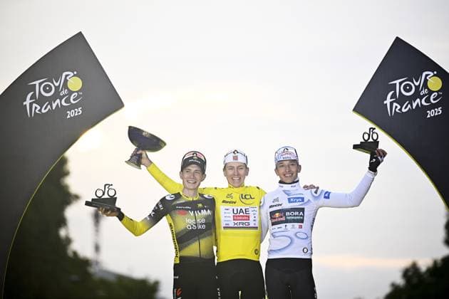Danish Jonas Vingegaard Hansen of Team Visma-Lease a Bike, Slovenian Tadej Pogacar of UAE Team Emirates and German Florian Lipowitz of RedBull-BORA-hansgrohe pictured on the podium after stage 21 of the 2025 Tour de France cycling race, from Mantes-la-Ville to Paris (120km), on Sunday 27 July 2025 in France. The 112th edition of the Tour de France starts on Saturday 5 July in Lille, France, and will finish in Paris, France on the 27th of July. JASPERxJACOBS  x130142851x