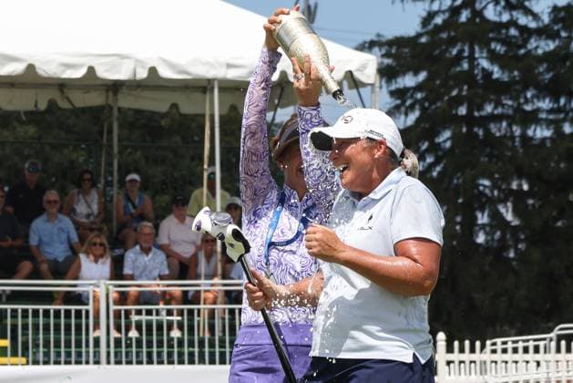 SYLVANIA, OH - JULY 27: Leta Lindley, behind, douses Angela Standord with champagne after Standford won the Greater Toledo Classic Hosted by Stacy Lewis Legends of the LPGA, Golf Damen tournament by making a birdie put on the 18th green during the second playoff hole on July 27, 2025 at Highland Meadows Golf Club in Sylvania, Ohio. (Photo by Scott W. Grau Icon Sportswire) GOLF: JUL 27 Greater Toledo Classic Hosted by Stacy Lewis Legends of the LPGA EDITORIAL USE ONLY Icon25072717