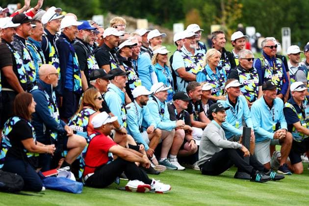 Joaquin Niemann of Chile celebrates winning the tournament with volunteers. LIV Golf UK, Day Three, Golf, JCB Golf & Country Club, Uttoxeter, UK - 27 Jul 2025Uttoxeter JCB Golf & Country Club United Kingdom EDITORIAL USE ONLY No use with unauthorised audio, video, data, fixture lists, club league logos or live services. Online in-match use limited to 120 images, no video emulation. No use in betting, games or single club league player publications.  Copyright: xJamesxMarsh Shutterstockx 15410873cn