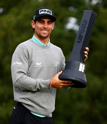 Joaquin Niemann of Chile celebrates winning the tournament with the trophy. LIV Golf UK, Day Three, Golf, JCB Golf & Country Club, Uttoxeter, UK - 27 Jul 2025Uttoxeter JCB Golf & Country Club United Kingdom EDITORIAL USE ONLY No use with unauthorised audio, video, data, fixture lists, club league logos or live services. Online in-match use limited to 120 images, no video emulation. No use in betting, games or single club league player publications.  Copyright: xJamesxMarsh Shutterstockx 15410873cm