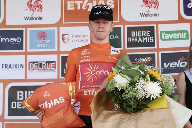 British Oliver Knight of Cofidis celebrates on the podium wearing the orange jersey of leader in the overall ranking after the third stage of the Tour De Wallonie cycling race, from Estinnes to Antoing (165,3km), on Monday 28 July 2025. BRUNOxFAHY  x130200345x