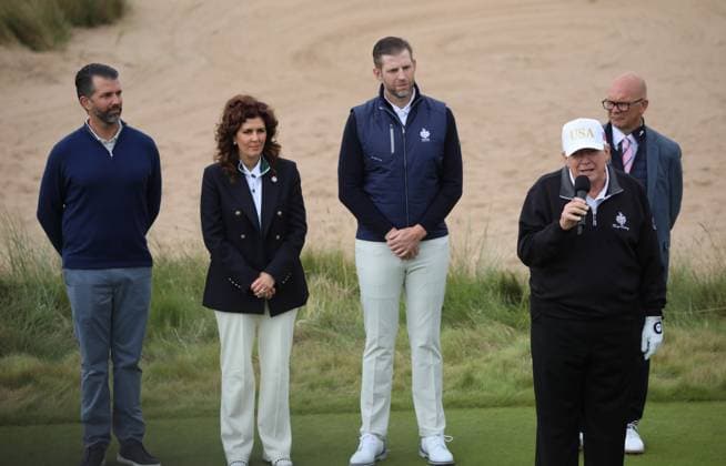 American President Donald Trump speaks at the opening of The New Course at Trump International Links surrounded by sons Donald Jr (L) and Eric (C), in Aberdeen, Scotland on Tuesday, July 29, 2025. Trump is on a four day visit to Scotland where he will be playing golf and meeting International leaders for trade discussions.  LON2025072927 HUGOxPHILPOTT
