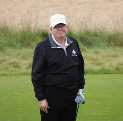 American President Donald Trump reacts after hitting the first ball at The New Course at Trump International Links, Aberdeen in Scotland on Tuesday, July 29, 2025. Trump is on a four day visit to Scotland where he will be playing golf and meeting International leaders for trade discussions.  LON2025072910 HUGOxPHILPOTT