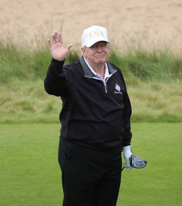 American President Donald Trump reacts after hitting the first ball at The New Course at Trump International Links, Aberdeen in Scotland on Tuesday, July 29, 2025. Trump is on a four day visit to Scotland where he will be playing golf and meeting International leaders for trade discussions.  LON2025072912 HUGOxPHILPOTT