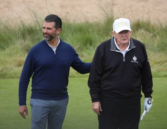 Donald Trump Jr and his father American President Donald Trump after opening The New Course at Trump International Links, Aberdeen in Scotland on Tuesday, July 29, 2025. Trump is on a four day visit to Scotland where he will be playing golf and meeting International leaders for trade discussions.  LON2025072921 HUGOxPHILPOTT