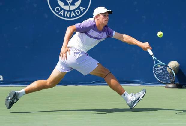 July 29, 2025, Toronto, On, CANADA: Nicolas Arseneault of Canada returns the ball against Alexei Popyrin of Australia during second round tennis action at the National Bank Open in Toronto on Tuesday, July 29, 2025. Canada News - July 29, 2025  - ZUMAc35_ 20250729_zaf_c35_054 Copyright: xNathanxDenettex