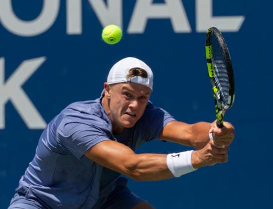 (250730) -- TORONTO, July 30, 2025 -- Holger Rune hits a return during the men s singles second round match between Holger Rune of Denmark and Giovanni Mpetshi Perricard of France at the 2025 National Bank Open tennis tournament in Toronto, Canada, July 29, 2025. (Photo by Xinhua) (SP)CANADA-TORONTO-TENNIS-NATIONAL BANK OPEN-MEN S SINGLES ZouxZheng 