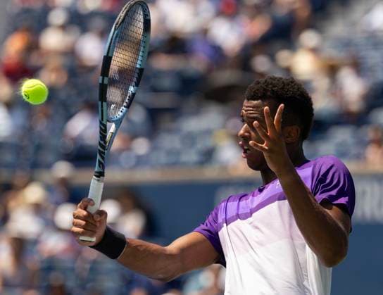 (250730) -- TORONTO, July 30, 2025 -- Giovanni Mpetshi Perricard hits a return during the men s singles second round match between Holger Rune of Denmark and Giovanni Mpetshi Perricard of France at the 2025 National Bank Open tennis tournament in Toronto, Canada, July 29, 2025. (Photo by Xinhua) (SP)CANADA-TORONTO-TENNIS-NATIONAL BANK OPEN-MEN S SINGLES ZouxZheng 