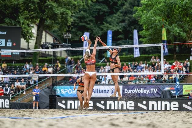 Beach volleyball I European Championship 2025 I Group stage I 30 07 2025 Maria BelÃ n Carro Marquez de Acuna Spain attempting to block Svenja Müllers attack Germany Düsseldorf Rochusclub Düsseldorfer Tennisclub e V Germany Copyright: xLobeca JasperxLorenzx