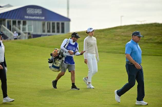 30th July 2025; Royal Porthcawl Golf Club, Porthcawl, Wales; AIG Womens Open Golf, Practice Day; Yealimi Noh talks with her caddy on the way to the 1st hole green  AledxHopkins