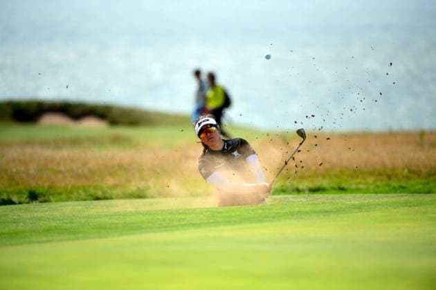 30th July 2025; Royal Porthcawl Golf Club, Porthcawl, Wales; AIG Womens Open Golf, Practice Day; Hannah Green taking a shot out of a bunker  AledxHopkins
