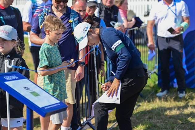 30th July 2025; Royal Porthcawl Golf Club, Porthcawl, Wales; AIG Womens Open Golf, Practice Day; MINJEE LEE signing a fans a flag after her round  AledxHopkins