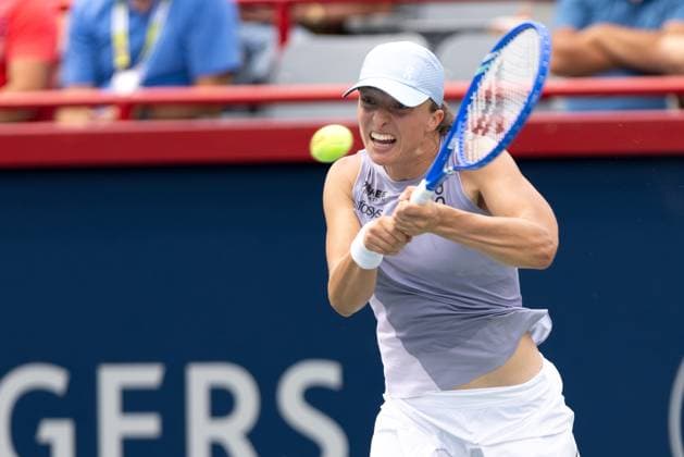 July 30, 2025, Montreal, Quebec, Canada: IGA SWIATEK (2) from Poland back hand in first set against Hanyu Guo (Q) from China in round of 64 at Canadian Open at IGA stadium in Montreal, Quebec, Canada on 2024-05-24 Montreal Canada - ZUMAl189 20250730_zsp_l189_071 Copyright: xYannickxLegarex