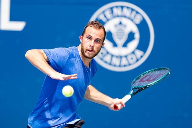 TORONTO, ON - JULY 30: Hugo Gaston (FRA) returns the ball during his second round match at ATP, Tennis Herren National Bank Open on July 30, 2025 at Sobeys Stadium in Toronto, ON, Canada (Photo by Julian Avram Icon Sportswire) TENNIS: JUL 30 National Bank Open EDITORIAL USE ONLY Icon2507300046