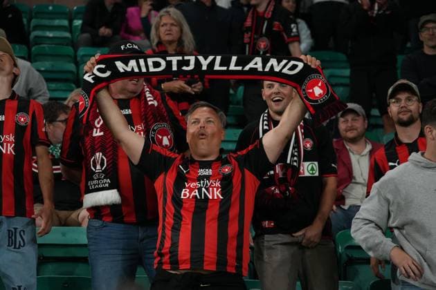 31st July 2025; Easter Road, Edinburgh, Scotland: UEFA Europa League, Second Qualifying Round, Second Leg, Hibernian versus Midtjylland; Midtjylland fans celebrate their winning goal from Junior Brumado  AlecxBrown