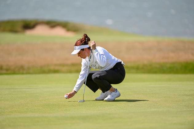 1st August 2025; Royal Porthcawl Golf Club, Porthcawl, Wales; AIG Womens Open Golf, Round 2; Georgia Hall marking her ball  AledxHopkins