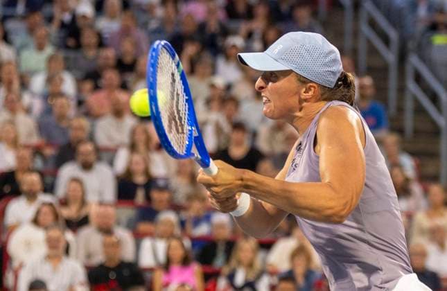 August 1, 2025, Montreal, Pq, Canada: Iga Swiatek of Poland hits a return to Eva Lys of Germany during third round tennis action at the National Bank Open in Montreal, Friday, Aug. 1, 2025. Canada News - August 1, 2025  - ZUMAc35_ 20250801_zaf_c35_151 Copyright: xChristinnexMuschix