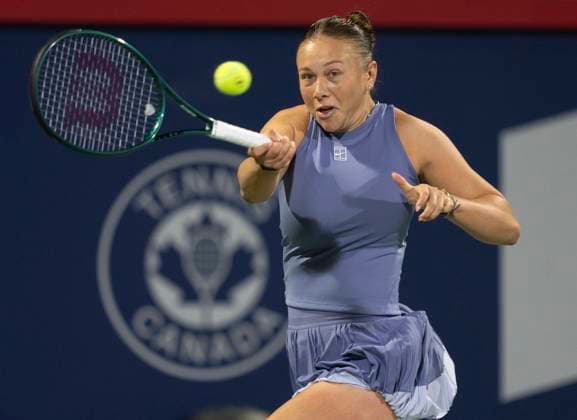 August 1, 2025, Montreal, Pq, Canada: Amanda Anisimova of the United States hits a return to Emma Raducanu of the United Kingdom during third round tennis action at the National Bank Open in Montreal, Friday, Aug. 1, 2025. Canada News - August 1, 2025  - ZUMAc35_ 20250801_zaf_c35_175 Copyright: xChristinnexMuschix