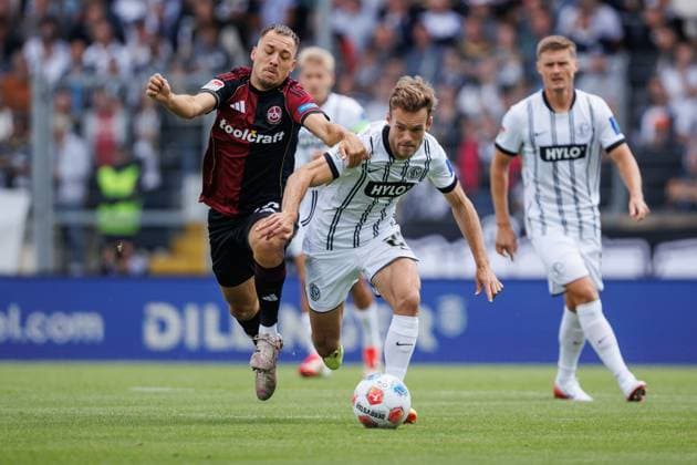 Tom Zimmerschied SV 07 Elversberg in duel with Julian Justvan 1 FC Nuernberg , SV Elversberg vs 1 FC Nuernberg, Soccer, 2 Bundesliga, 1 Matchday, Season 2025 2026, 02 08 2025 DFB regulations prohibit any use of photographs as image sequences and or quasi video SV Elversberg vs 1 FC Nuernberg, Soccer, 2 Bundesliga, 1 Matchday, Season 2025 2026, 02 08 2025 Copyright: xEibner-Pressefoto AlexanderxNeisx EP_ANS