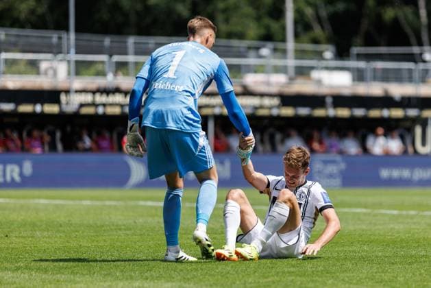 Jan Reichert 1 FC Nuernberg helps Tom Zimmerschied SV 07 Elversberg , SV Elversberg vs 1 FC Nuernberg, Soccer, 2 Bundesliga, 1 Matchday, Season 2025 2026, 02 08 2025 DFB regulations prohibit any use of photographs as image sequences and or quasi video SV Elversberg vs 1 FC Nuernberg, Soccer, 2 Bundesliga, 1 Matchday, Season 2025 2026, 02 08 2025 Copyright: xEibner-Pressefoto AlexanderxNeisx EP_ANS