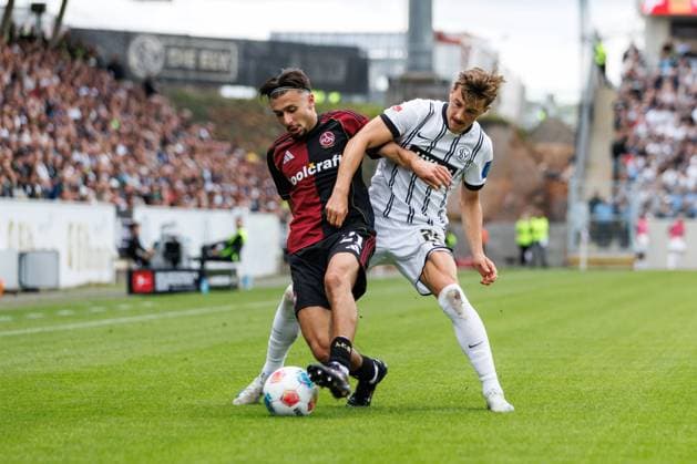 Berkay Yilmaz 1 FC Nuernberg in duel with Lukas Petkov SV 07 Elversberg , SV Elversberg vs 1 FC Nuernberg, Soccer, 2 Bundesliga, 1 Matchday, Season 2025 2026, 02 08 2025 DFB regulations prohibit any use of photographs as image sequences and or quasi video SV Elversberg vs 1 FC Nuernberg, Soccer, 2 Bundesliga, 1 Matchday, Season 2025 2026, 02 08 2025 Copyright: xEibner-Pressefoto AlexanderxNeisx EP_ANS