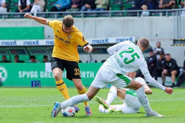 Christoph Daferner Dynamo Dresden and Brynjar Ingi Bjarnason SpVgg Greuther Fuerth battle for the ball, 2 Bundesliga, SpVgg Greuther Fürth v Dynamo Dresden, Sportpark Ronhof Thomas Sommer on August 03, 2025 in Fürth, Germany Photo by Marco Steinbrenner DeFodi Images Christoph Daferner Dynamo Dresden and Brynjar Ingi Bjarnason SpVgg Greuther Fuerth battle for the ball, 2 Bundesliga, SpVgg Greuther Fuerth v Dynamo Dresden, Sportpark Ronhof Thomas Sommer, August 3, 2025 in Fuerth, Germany Photo by Marco Steinbrenner DeFodi Images DFB DFL REGULATIONS PROHIBIT ANY USE OF PHOTOGRAPHS AS IMAGE SEQUENCES AND OR QUASI VIDEO