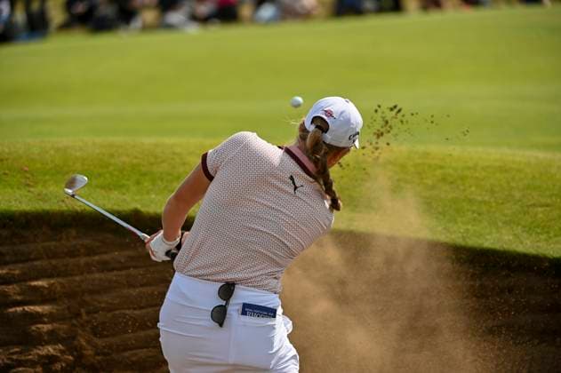 3rd August 2025; Royal Porthcawl Golf Club, Porthcawl, Wales; AIG Womens Open Golf, Final Round; Mimi Rhodes explodes out of the greenside bunker on 13  AledxHopkins