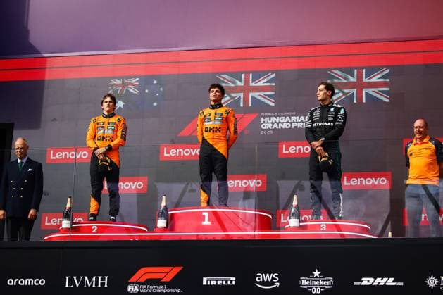August 3, 2025, Budapest, Hungary: Lando Norris of McLaren, Oscar Piastri of McLaren and George Russell of Mercedes are seen on the podium during the Formula 1 Hungarian Grand Prix at the Hungaroring circuit in Mogyorod near Budapest on August 3rd, 2025. Budapest Hungary - ZUMAz156 0828763685st Copyright: xBeataxZawrzelx