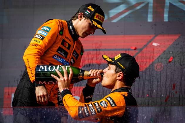F1 HUNGARIAN GRAND PRIX RACE Lando Norris of Great Britain and McLaren and Oscar Piastri of Australia and McLaren celebrates on podium with a champagne after sunday s race of the F1 Grand Prix of Hungary at Hungaroring Circuit on August 03, 2025, in Budapest, Hungary. Copyright: xx 080A2356