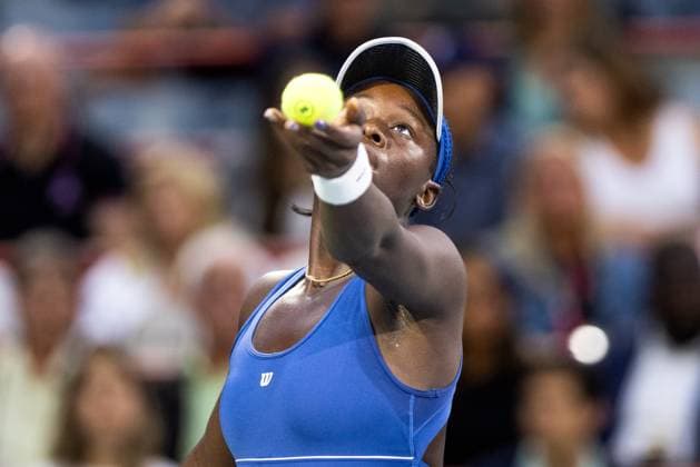 August 4, 2025, Montreal, Quebec, Canada: VICTORIA MBOKO (WC) from Canada serving in first set against Jessica Bouzas Maneiro from Spain in quarter final at Canadian Open at IGA stadium in Montreal, Quebec, Canada on 2025-08-04 Montreal Canada - ZUMAl189 20250804_zsp_l189_041 Copyright: xYannickxLegarex