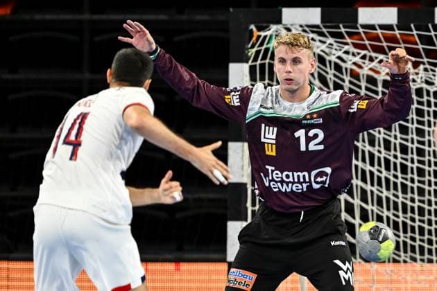 Ferran Sole Sala Paris Saint Germain and goalkeeper Kristian Saveras FRISCH AUF Goeppingen battle for the ball during the Handball Friendly match between Frisch Auf Göppingen and Paris Saint Germain at ratiopharm Arena on August 5, 2025 in Neu Ulm, Germany Photo by Harry Langer DeFodi Images