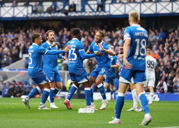Djeidi Gassama of Rangers celebrates with Cyriel Dessers of Rangers (assist) and team mates after scoring to give Rangers a 1-0 lead. Rangers v Viktoria Plzen, UEFA Champions League, 3rd Qualifying Round, First Leg, Football, Ibrox Stadium, Glasgow, Scotland, UK - 05 Aug 2025Glasgow Ibrox Stadium Scotland United Kingdom EDITORIAL USE ONLY No use with unauthorised audio, video, data, fixture lists, club league logos or live services. Online in-match use limited to 120 images, no video emulation. No use in betting, games or single club league player publications. Copyright: xStuartxWallace Shutterstockx 15428174l