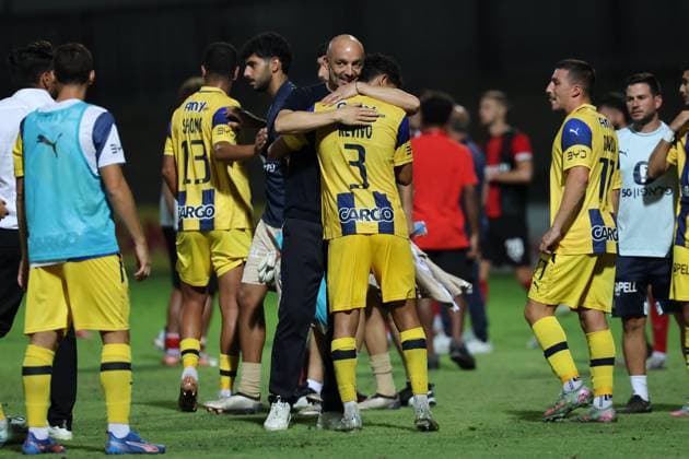 Zarko Lazetic, head coach of Tel Aviv embraces Roy Revivo after the the UEFA Europa League Third qualifying round, 1st leg soccer match between Hamrun Spartans FC and Maccabi Tel Aviv FC at the Tony Bezzina Stadium, in Paola, Malta, on 05 August 2025. UEFA Europa League - Hamrun Spartans FC v Maccabi Tel Aviv FC