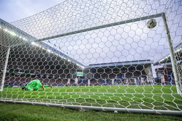 Cyriel Dessers of Rangers scores his penalty kick past FC Viktoria Plzen goalkeeper Florian Wiegele during the Champions League third qualifying round first leg match at Ibrox Stadium, Glasgow. Rangers v Viktoria Plzen - UEFA Champions League - Third Qualifying Round First Leg - Ibrox Stadium, Glasgow, Lanarkshire, Scotland, UK - 05 Aug 2025Glasgow Ibrox Lanarkshire United Kingdom  Copyright: xO Rourke RangersxFC Shutterstockx 15428761bp