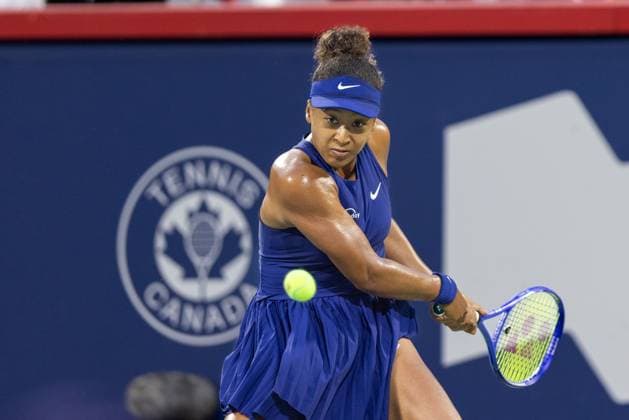 August 5, 2025, Montreal, Quebec, Canada: NAOMI OSAKA from Japan back hand in first set against Elina Svitolina (10) from Ukraine in quarter final at Canadian Open at IGA stadium in Montreal, Quebec, Canada on 2025-08-05 Montreal Canada - ZUMAl189 20250805_zsp_l189_034 Copyright: xYannickxLegarex