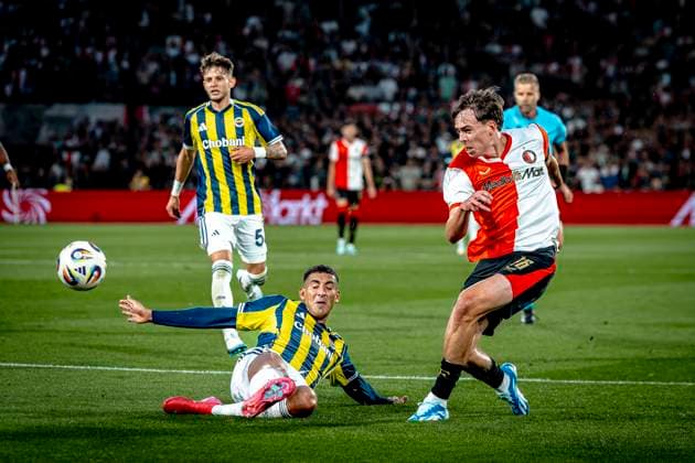 Fenerbahce SK defender Mert Muldur, Feyenoord Rotterdam forwarder Leo Sauer during the match Feyenoord Fenerbahce at the Kuip Stadium for the third qualifying round champions league season 2025 2026 in Rotterdam, Netherlands on 6 august 2025, photo by Marcel van Dorst EYE4images DeFodi Images