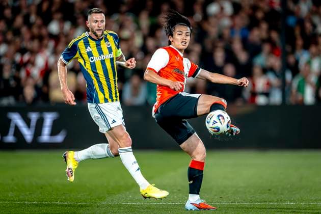 Fenerbahce SK defender Mila Skriniar, Feyenoord Rotterdam forwarder Ayase Ueda during the match Feyenoord Fenerbahce at the Kuip Stadium for the third qualifying round champions league season 2025 2026 in Rotterdam, Netherlands on 6 august 2025, photo by Marcel van Dorst EYE4images DeFodi Images