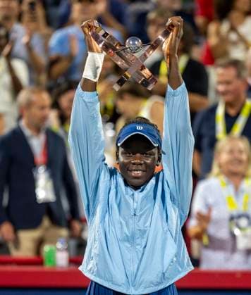 August 7, 2025, Montreal, Pq, Canada: Victoria Mboko of Canada hoists the trophy following her win over Naomi Osaka of Japan during finals tennis action at the National Bank Open in Montreal, Thursday, Aug. 7, 2025. Canada News - August 7, 2025  - ZUMAc35_ 20250807_zaf_c35_168 Copyright: xChristinnexMuschix