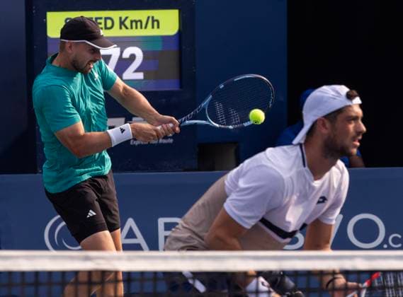 (250808) -- TORONTO, Aug. 8, 2025 -- Julian Cash Lloyd Glasspool (L) compete during the men s doubles final match between Joe Salisbury Neal Skupski of Britain and Julian Cash Lloyd Glasspool of Britain at the 2025 National Bank Open tennis tournament in Toronto, Canada, on Aug. 7, 2025. (Photo by Xinhua) (SP)CANADA-TORONTO-TENNIS-NATIONAL BANK OPEN-MEN S DOUBLES FINAL ZouxZeng 