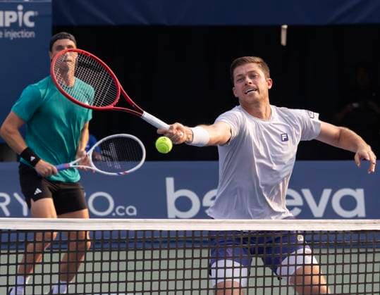 (250808) -- TORONTO, Aug. 8, 2025 -- Joe Salisbury Neal Skupski (R) compete during the men s doubles final match between Joe Salisbury Neal Skupski of Britain and Julian Cash Lloyd Glasspool of Britain at the 2025 National Bank Open tennis tournament in Toronto, Canada, on Aug. 7, 2025. (Photo by Xinhua) (SP)CANADA-TORONTO-TENNIS-NATIONAL BANK OPEN-MEN S DOUBLES FINAL ZouxZeng 