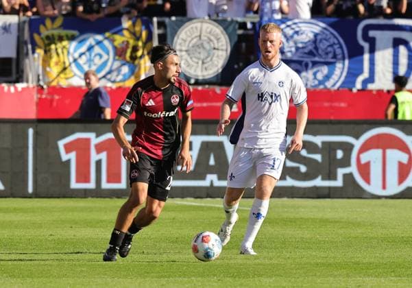 08 08 2025 Soccer Season 2025 2026 2 Soccer Bundesliga 02 Matchday 1 FC Nürnberg FCN Club SV Darmstadt 98 SVD Lilien Sportfoto Zink DaMa xdaxmax DFL regulations prohibit any use of photographs as image sequences and or quasi video only for editorial use Berkay Yilmaz 21, 1 FC Nürnberg FCN Kai Klefisch 17, SV Darmstadt 98 D98 SV98